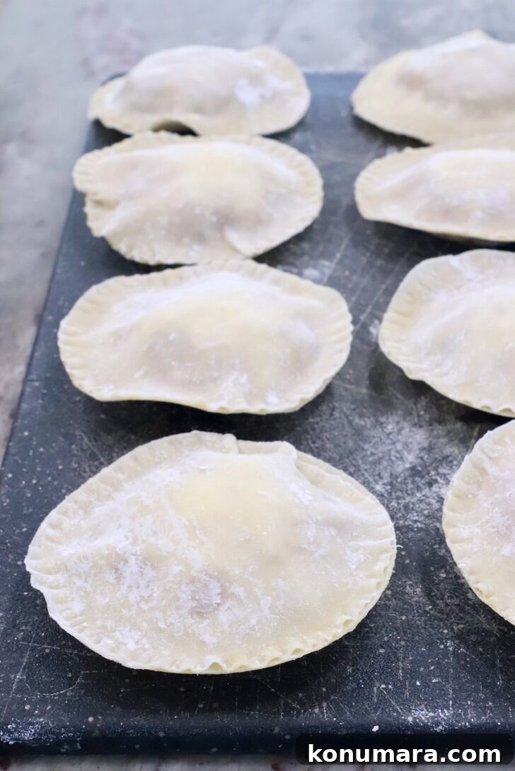 round raviolis on a dark cutting board