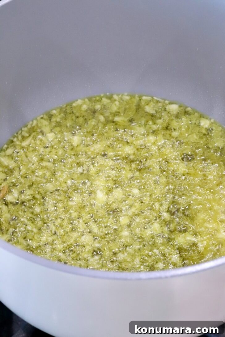 minced garlic in oil in a white pot