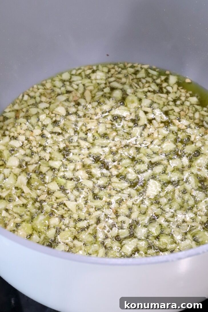 pot of oil and minced garlic on the stove