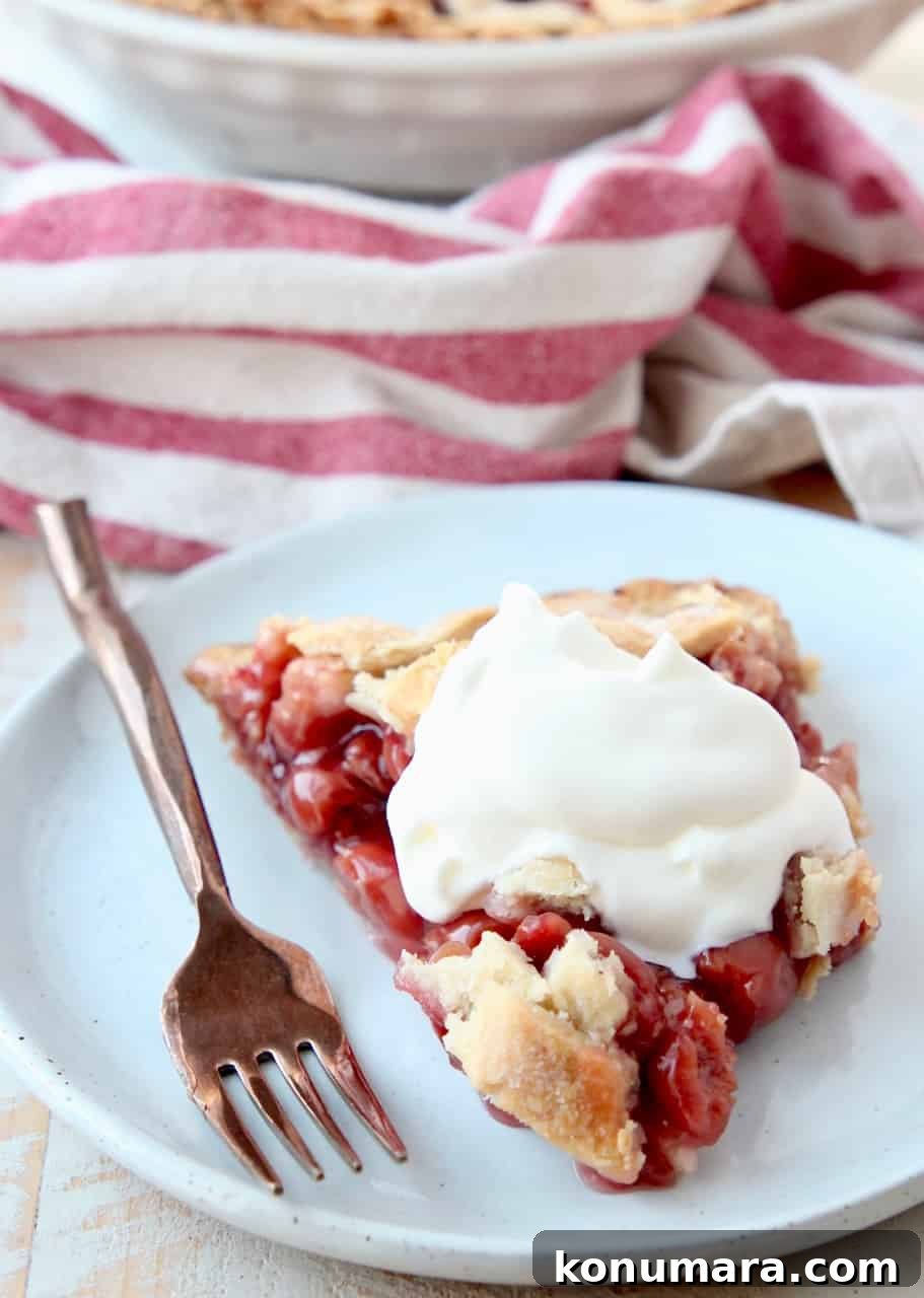 piece of pie on plate topped with whipped cream