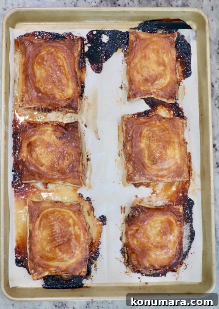 baked upside-down tarts on a parchment-lined baking sheet