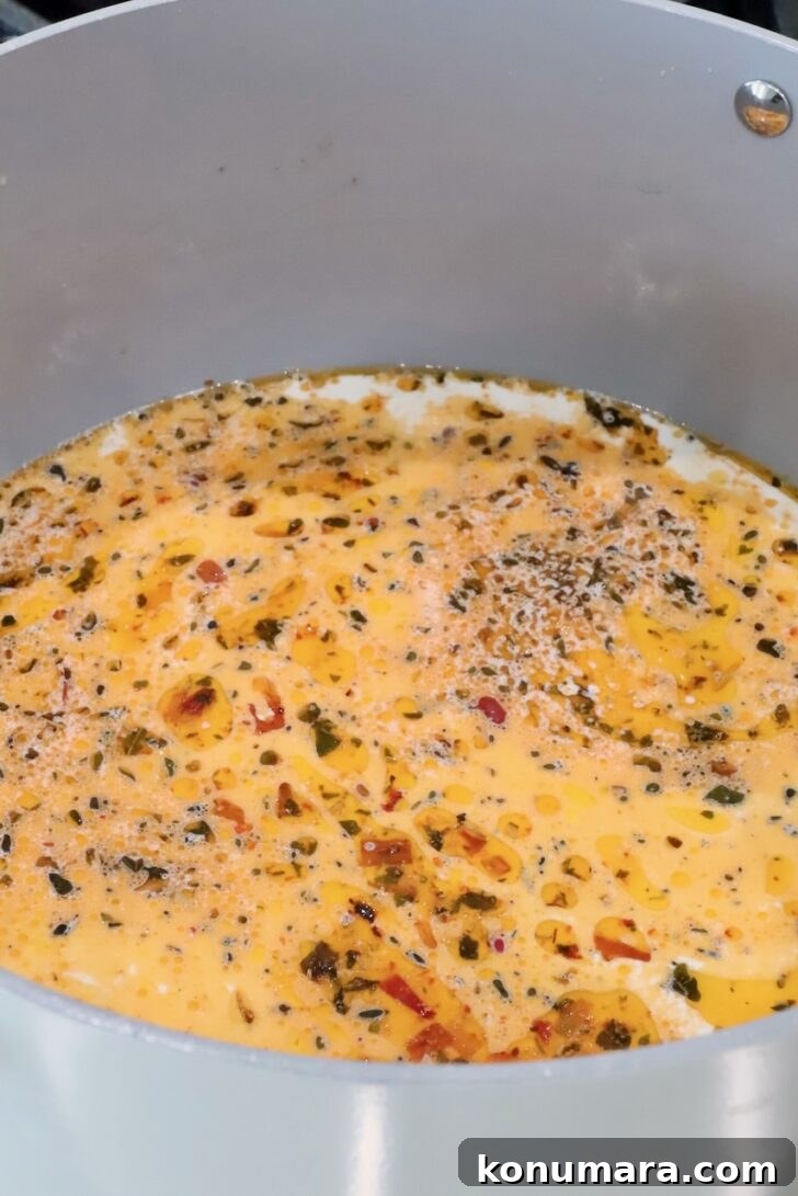 creamy tuscan pasta sauce in a pan on the stove