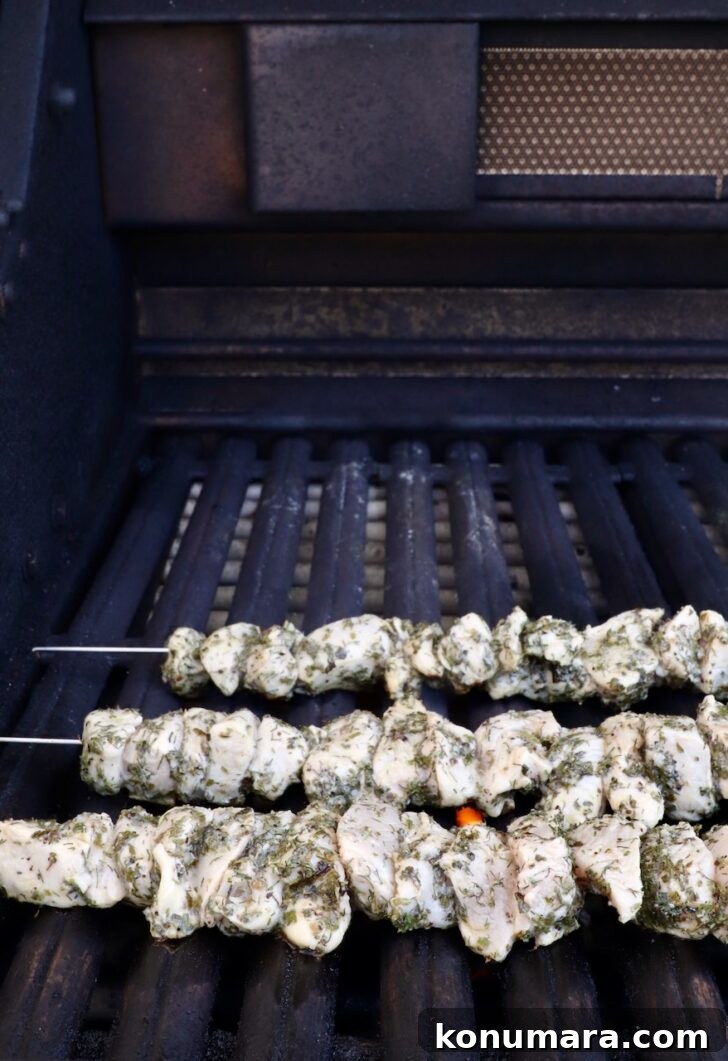 How to Make Authentic Greek Souvlaki 8 raw chicken skewers on a grill