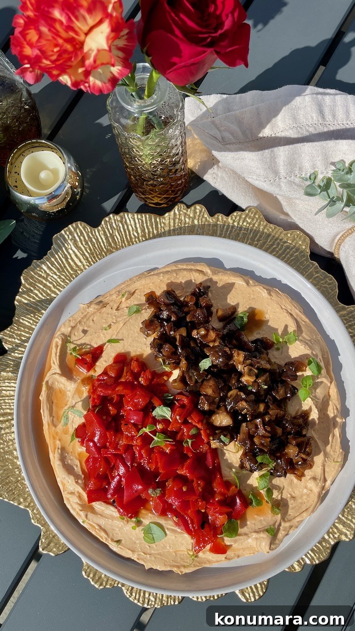whipped goat cheese topped with mushroom jam and diced roasted peppers