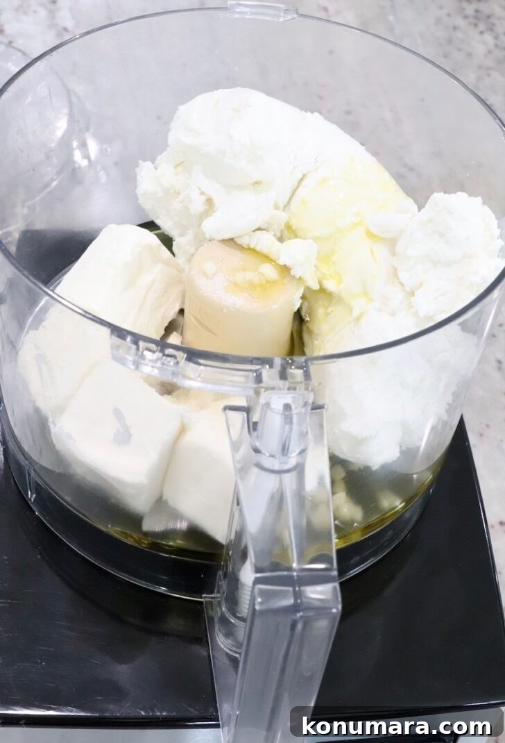 goat cheese, cream cheese, garlic and olive oil in a food processor
