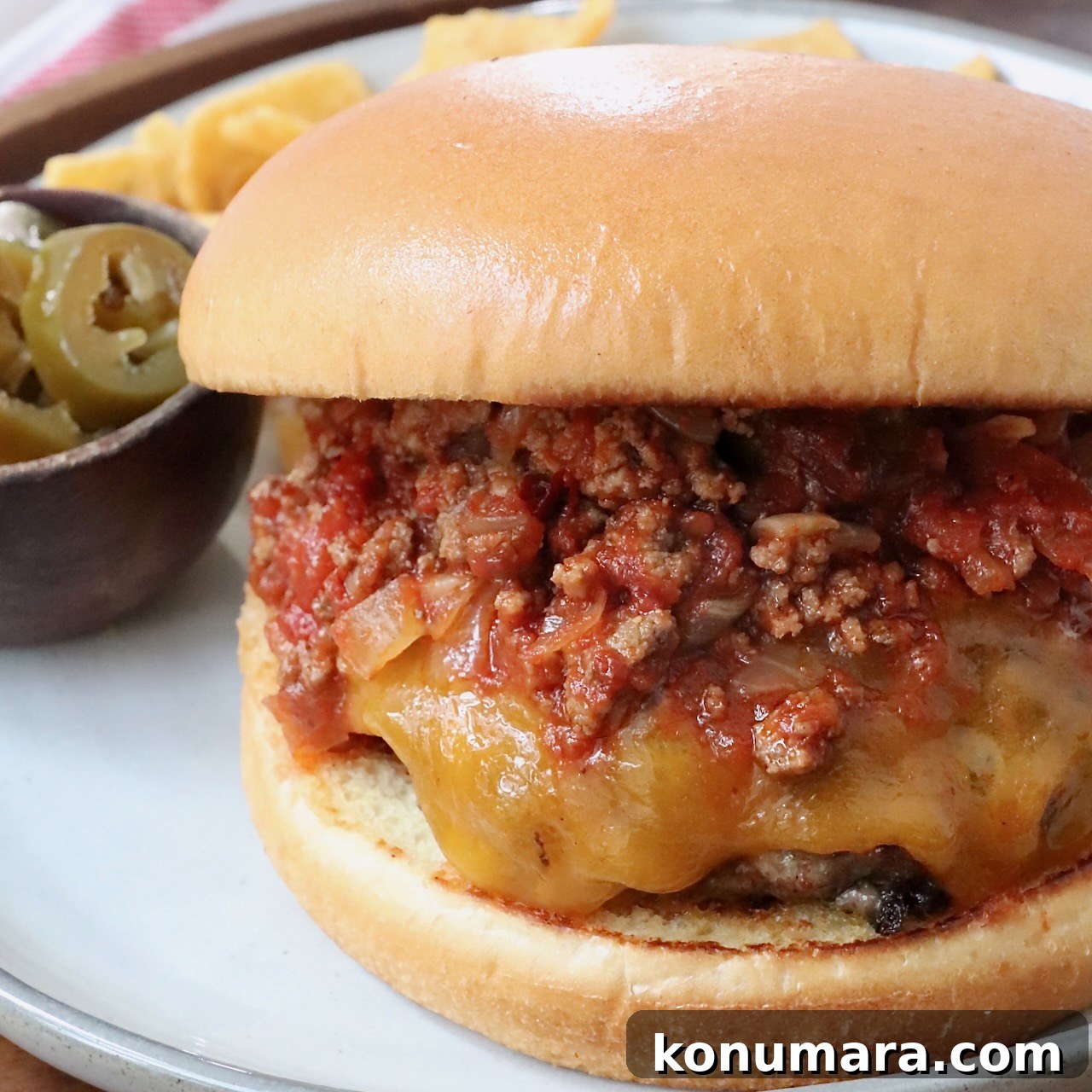 Cheeseburger topped with chili