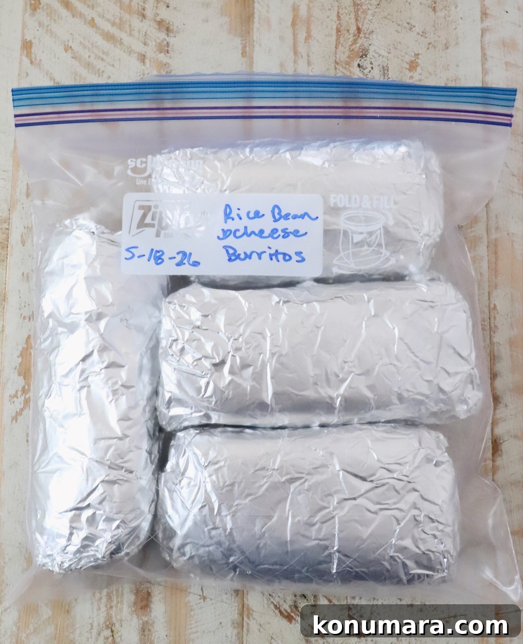 Vegetarian Cheesy Bean and Rice Burrito Recipe 16 burritos wrapped in foil in a plastic zipper bag