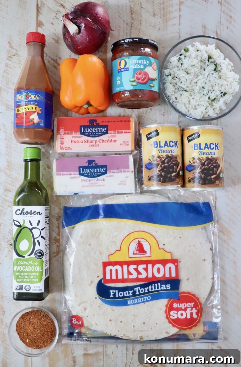 Vegetarian Cheesy Bean and Rice Burrito Recipe 5 ingredients for cheesy bean and rice burritos on a white wood board