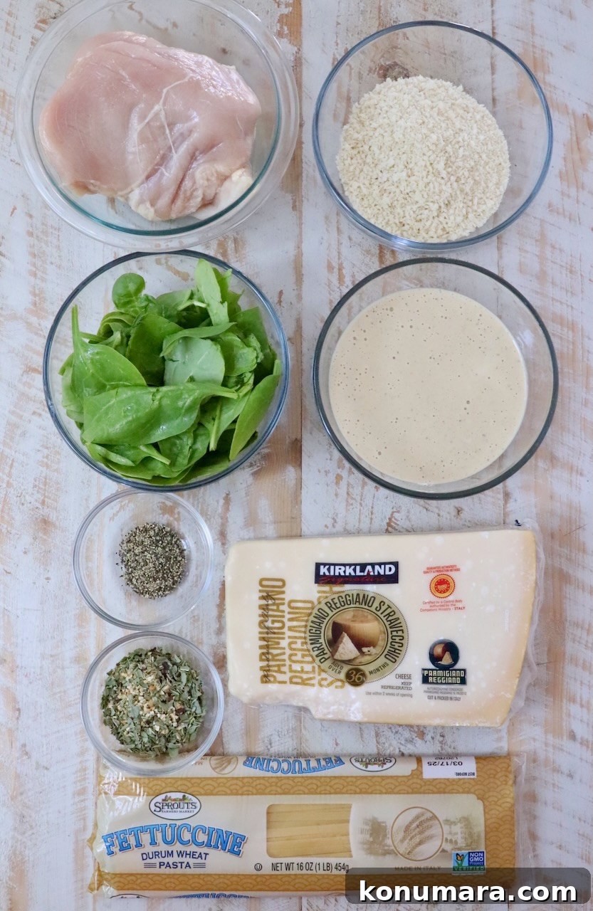 Creamy Chicken Caesar Pasta with Parmesan and Croutons 5 ingredients for chicken caesar pasta on a white wood board