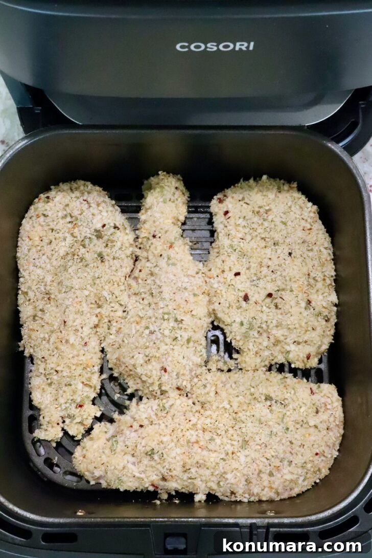 Creamy Chicken Caesar Pasta with Parmesan and Croutons 8 breaded chicken breasts in an air fryer basket