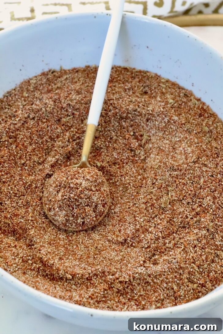 barbacoa seasoning in a bowl with a spoon
