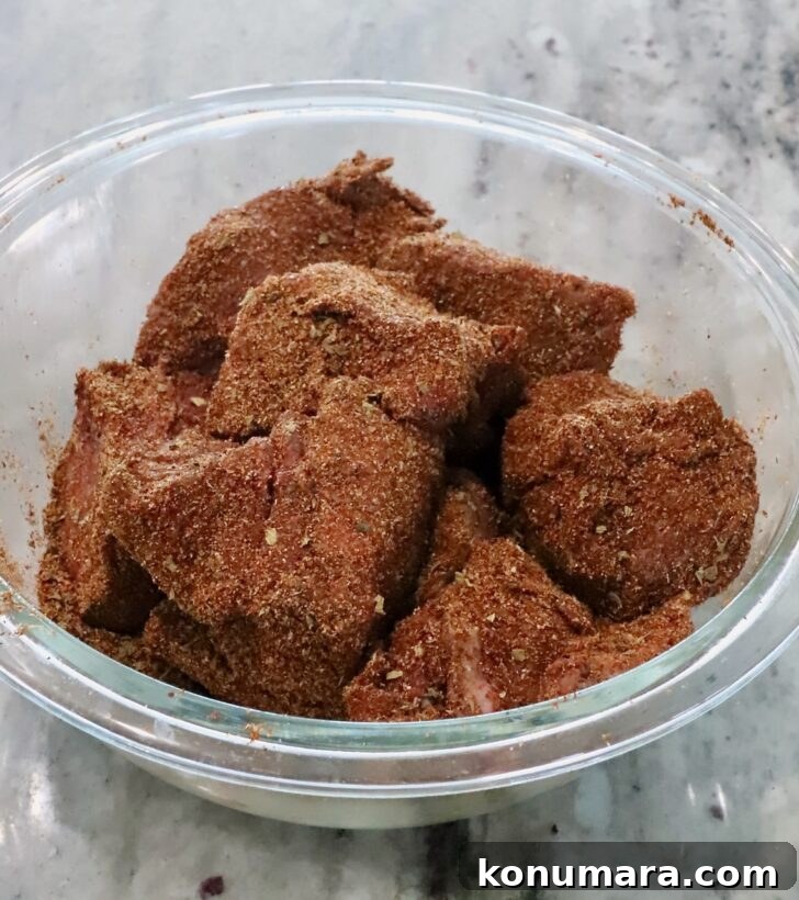 seasoned chunks of beef in a glass bowl