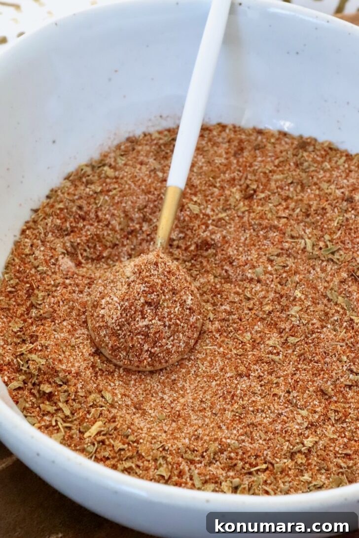 chicken taco seasoning in a bowl with a spoon