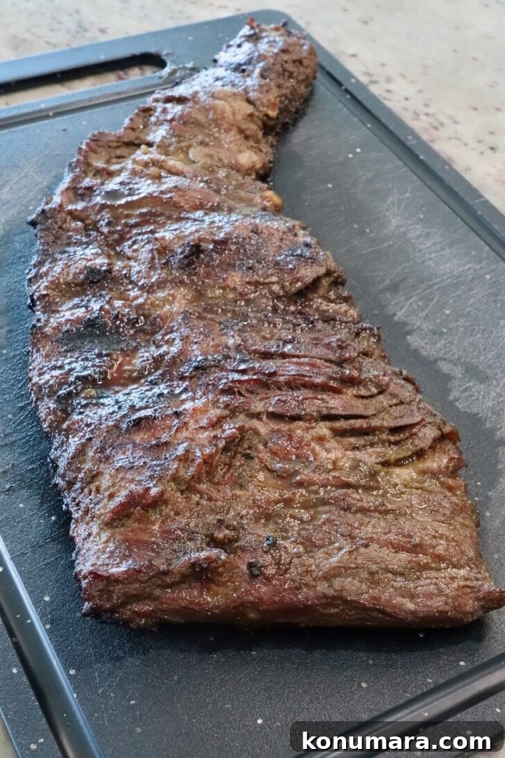 grilled skirt steak resting on a cutting board
