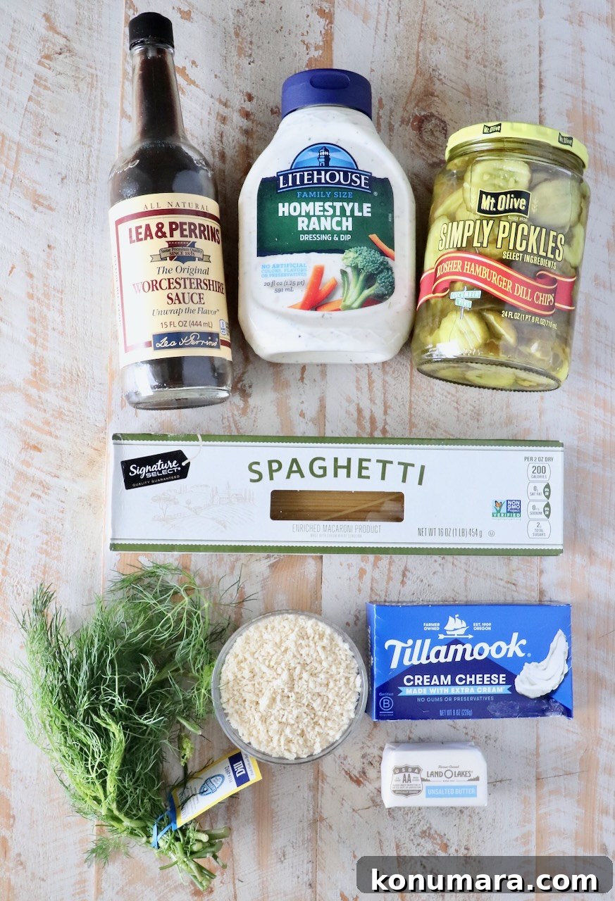 Creamy Dill Pickle Pasta Recipe 5 ingredients for pickle pasta with a creamy sauce on a white wood table