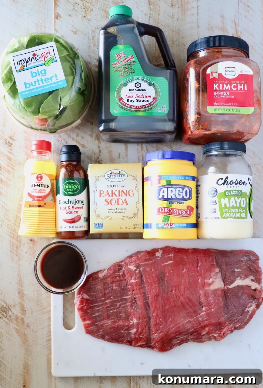 Korean Beef Bulgogi Lettuce Wraps Recipe 5 ingredients for Korean bbq beef lettuce wraps on a white wood board