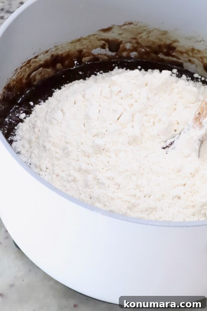brownie batter topped with flour in a pot