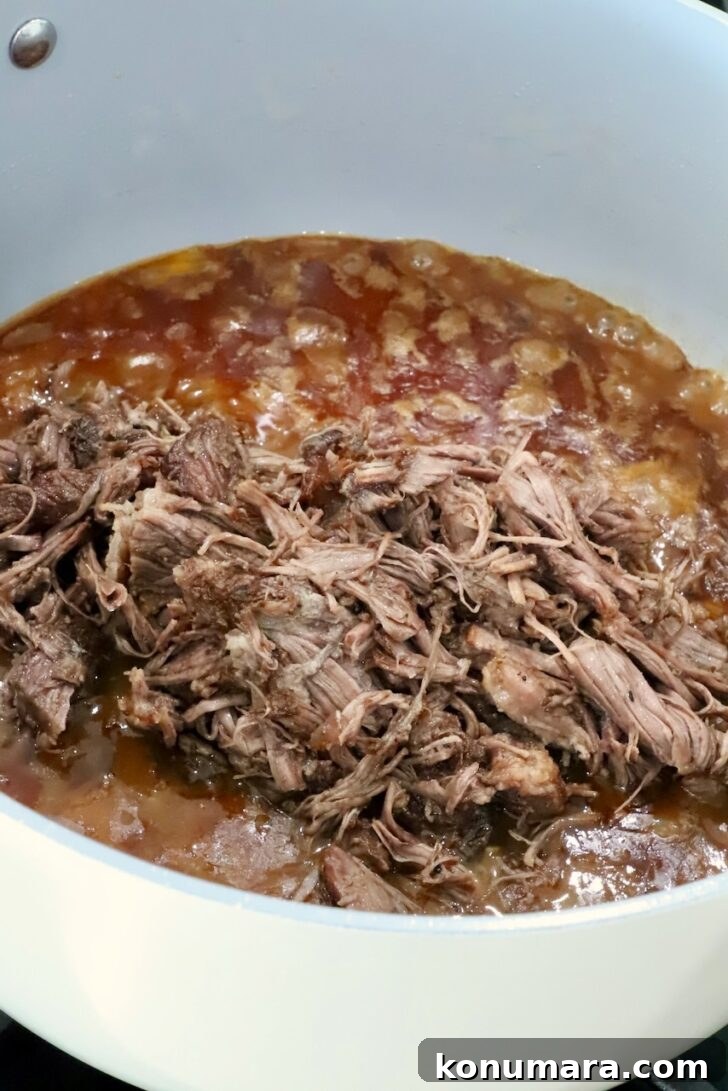 Braised Short Rib Pot Pie with French Onion 12 shredded, cooked short ribs on top of caramelized onions and beef broth in a pot