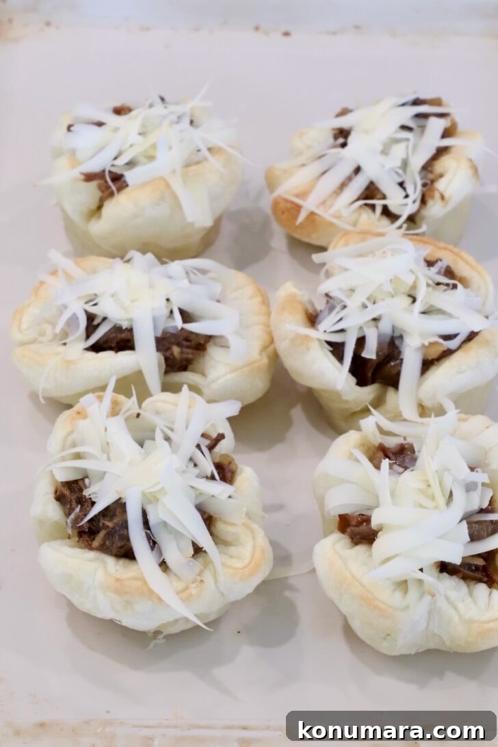 Braised Short Rib Pot Pie with French Onion 22 puff pastry shells filled with shredded beef and topped with shredded gruyere cheese