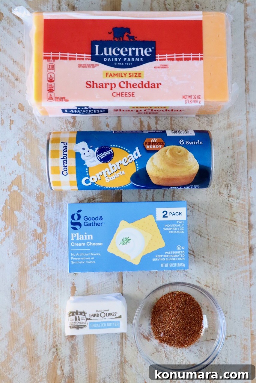 Cheesy Cornbread Rolls Recipe: Soft, Melty Centers 5 ingredients for cheesy cornbread rolls on a white wood surface