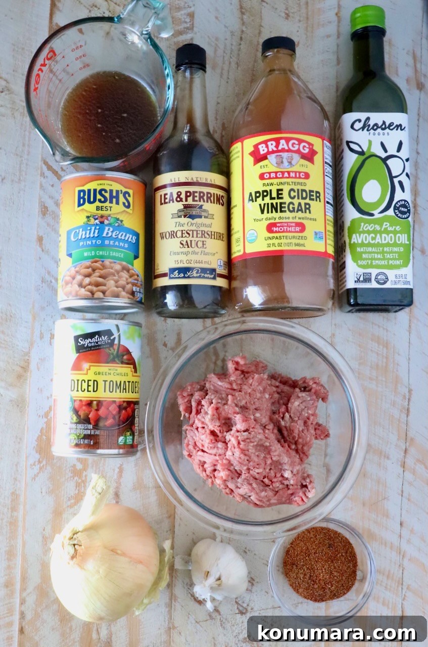 ingredients for chili on a white wood table
