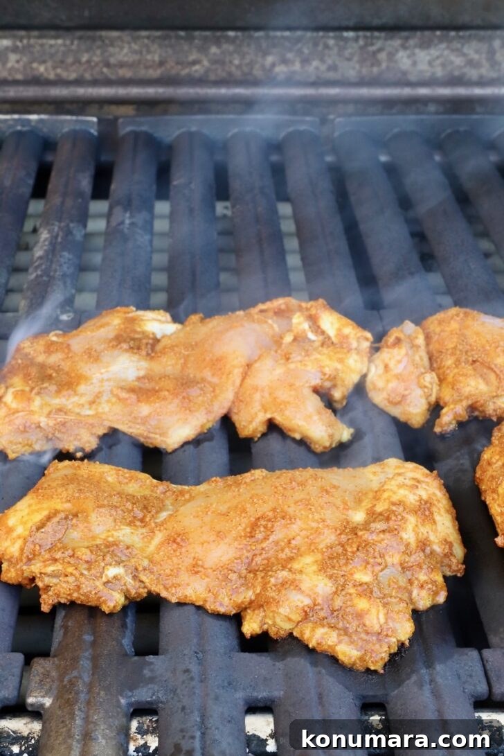 Chicken Shawarma Tacos with Garlic Yogurt Sauce 7 shawarma marinated chicken thighs on a grill