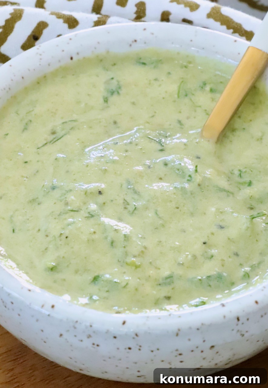 poblano ranch dressing in a bowl with a spoon