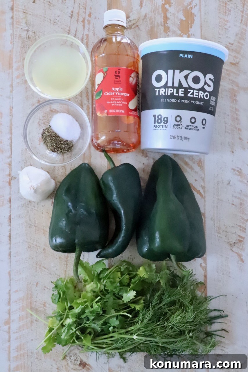 ingredients for poblano ranch dressing on a white wood board