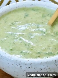poblano ranch dressing in a small bowl with a spoon