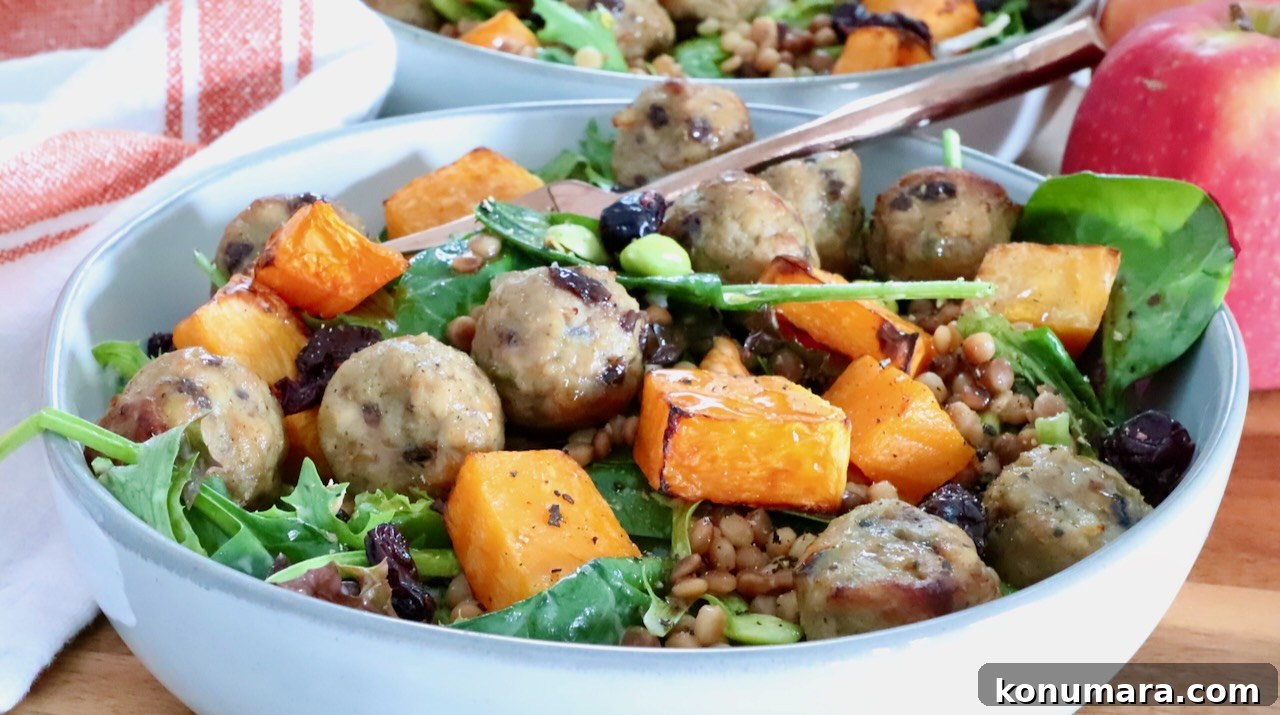 Autumn Harvest Grain Bowl with Roasted Squash and Quinoa 11 bowl filled with spinach, butternut squash, meatballs and couscous