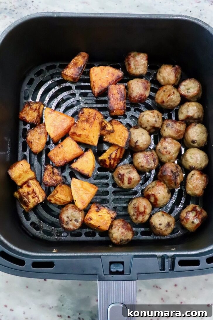 Autumn Harvest Grain Bowl with Roasted Squash and Quinoa 7 cubed butternut squash and chicken meatballs in an air fryer basket