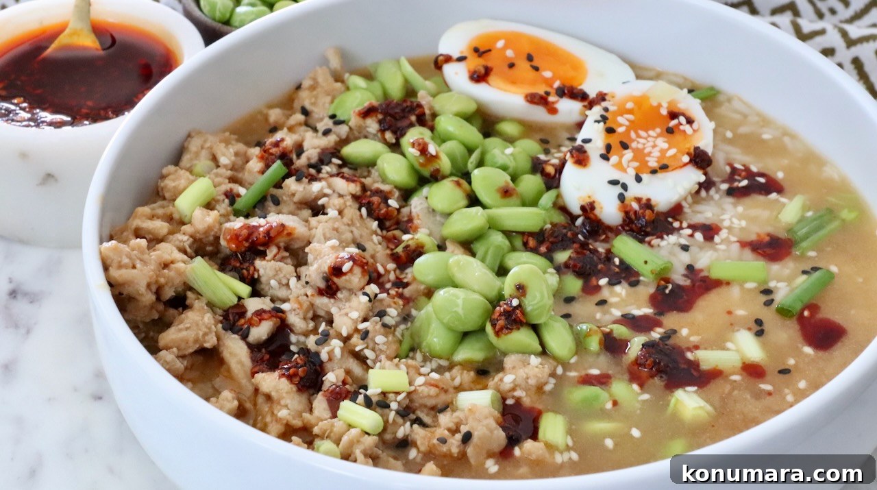 miso ginger broth bowl with ground chicken, edamame, and soft boiled eggs